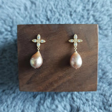 Load image into Gallery viewer, Freshwater pearl drops set with four petals floral style earposts