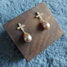 Load image into Gallery viewer, Freshwater pearl drops set with four petals floral style earposts