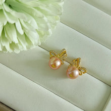 Load image into Gallery viewer, Peachy Pink Freshwater pearls set in CZ delicate ribbon style studs (Gold)
