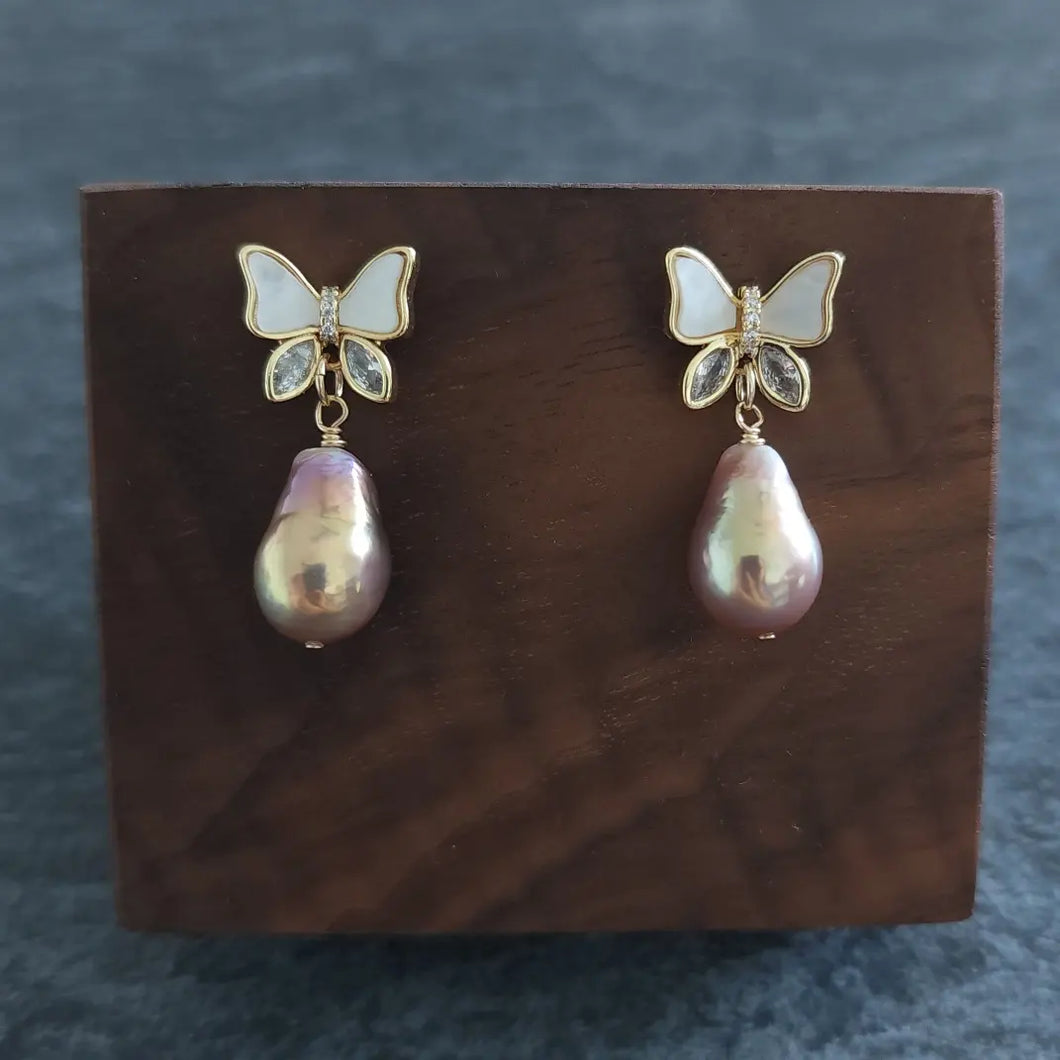 Freshwater pearl drops set with butterfly style earposts
